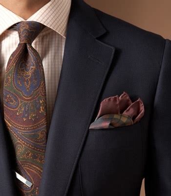 paisley tie with checkered shirt.